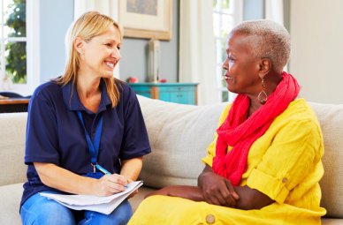 senior woman and health care staff talking