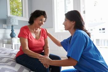 caregiver and a woman staring to each other